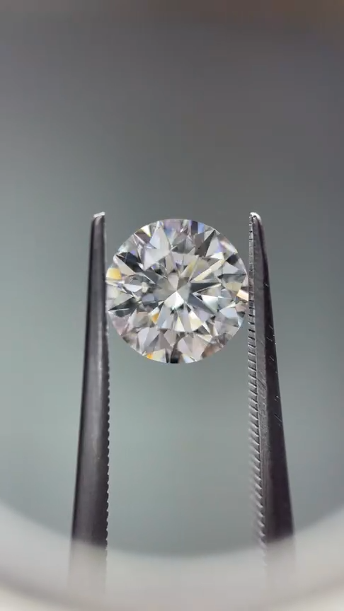 Tweezers holding single diamond close-up